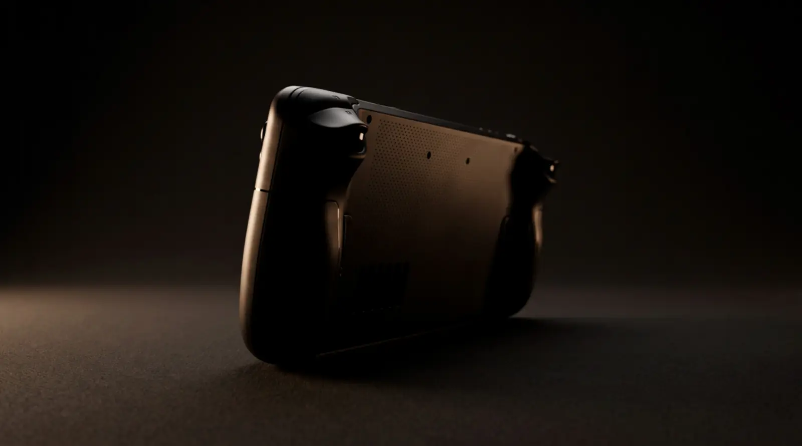 Schwarzes Handheld im Dreiviertelprofil in fast völliger Dunkelheit, ein einzelner Lichtstreif zeichnet Bildschirmkante und Griff nach. (KI-generiert)